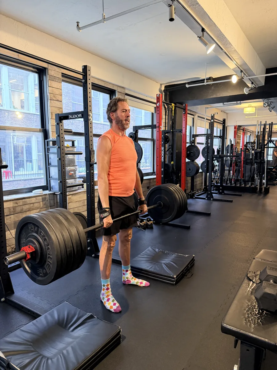 Senior strength training NYC — BUF Over 50 client deadlifting at the Midtown Manhattan studio