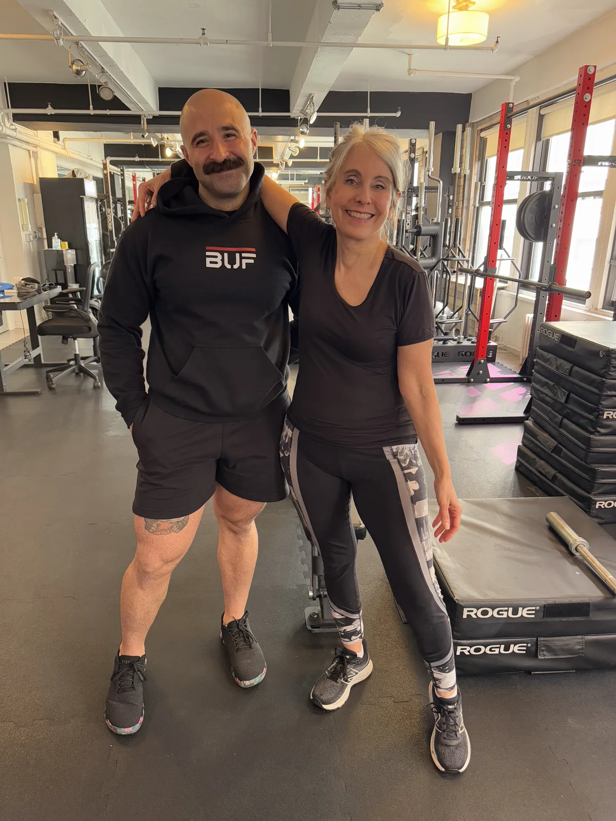 BUF Over 50 trainer and senior client celebrating progress at the Midtown Manhattan personal training studio