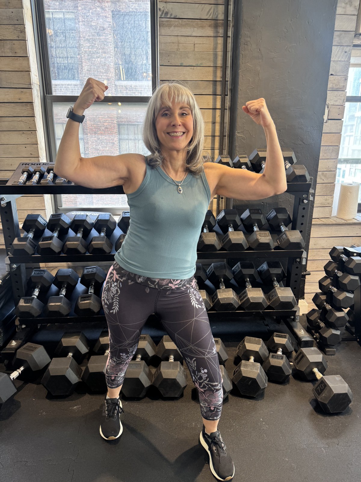 Senior strength training NYC — BUF Over 50 client celebrating her strength gains at the Midtown Manhattan studio